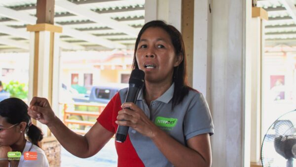 Conservationist speaking into a microphone